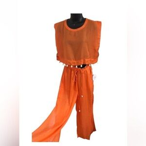 Orange 2 piece sheer cowrie shell adorned crop top and split leg pants beach set